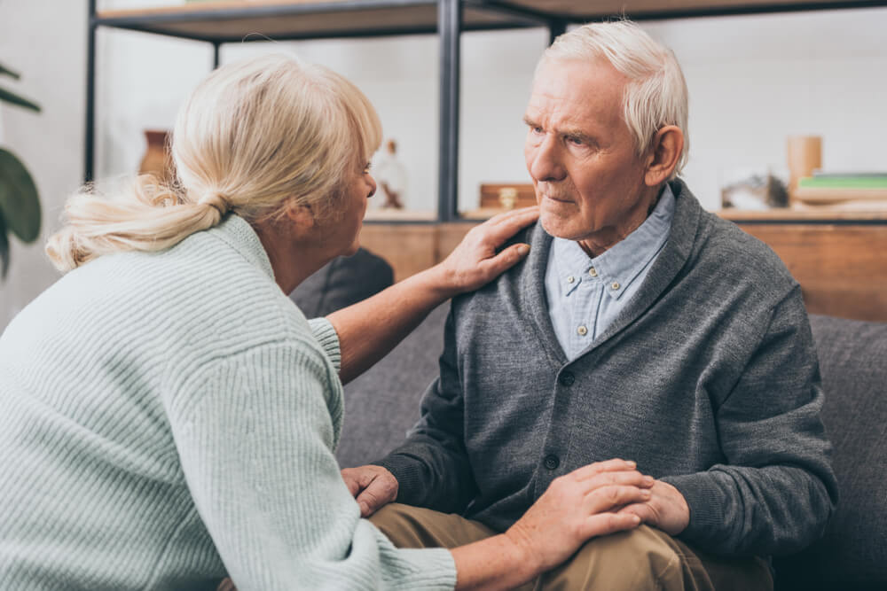 Retired Couple Holding Hands and Looking at Each Other