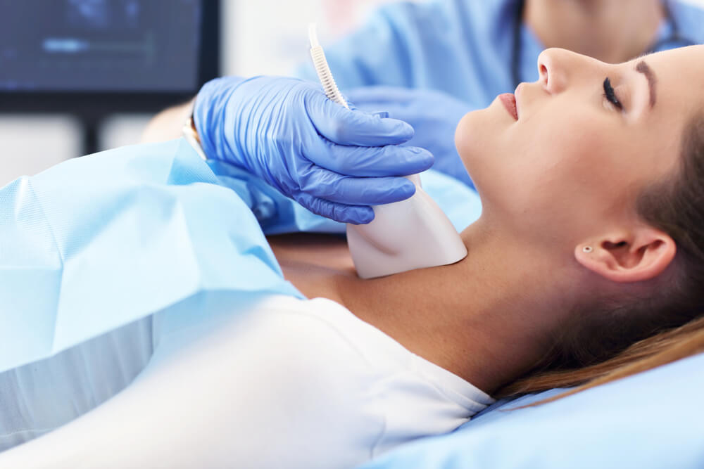 Woman Getting Thyroid Ultrasound