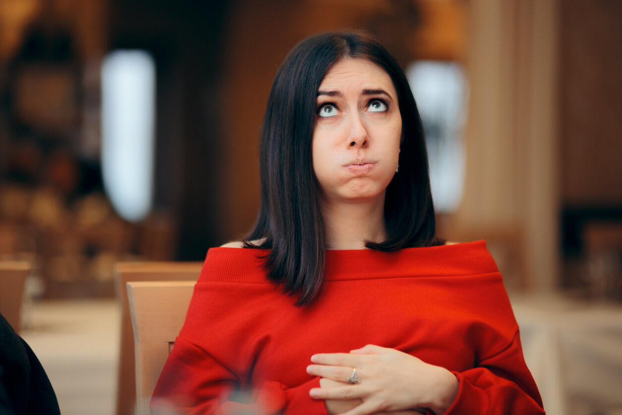 Girl With Hands on Her Abdomen Suffering After Eating Too Much