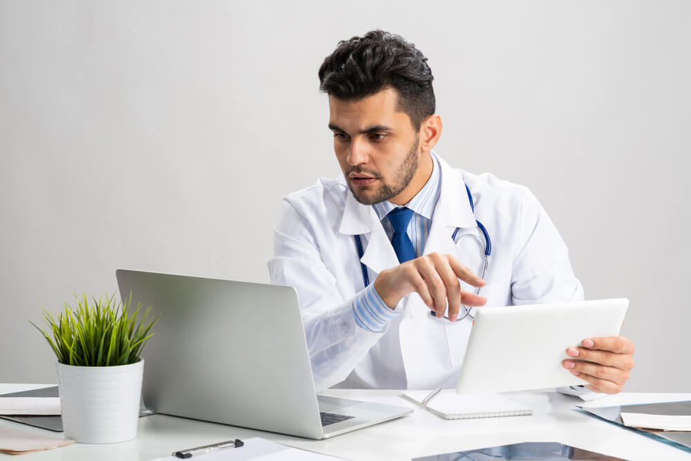 Young Arab Internist Working With Tablet Computer. 