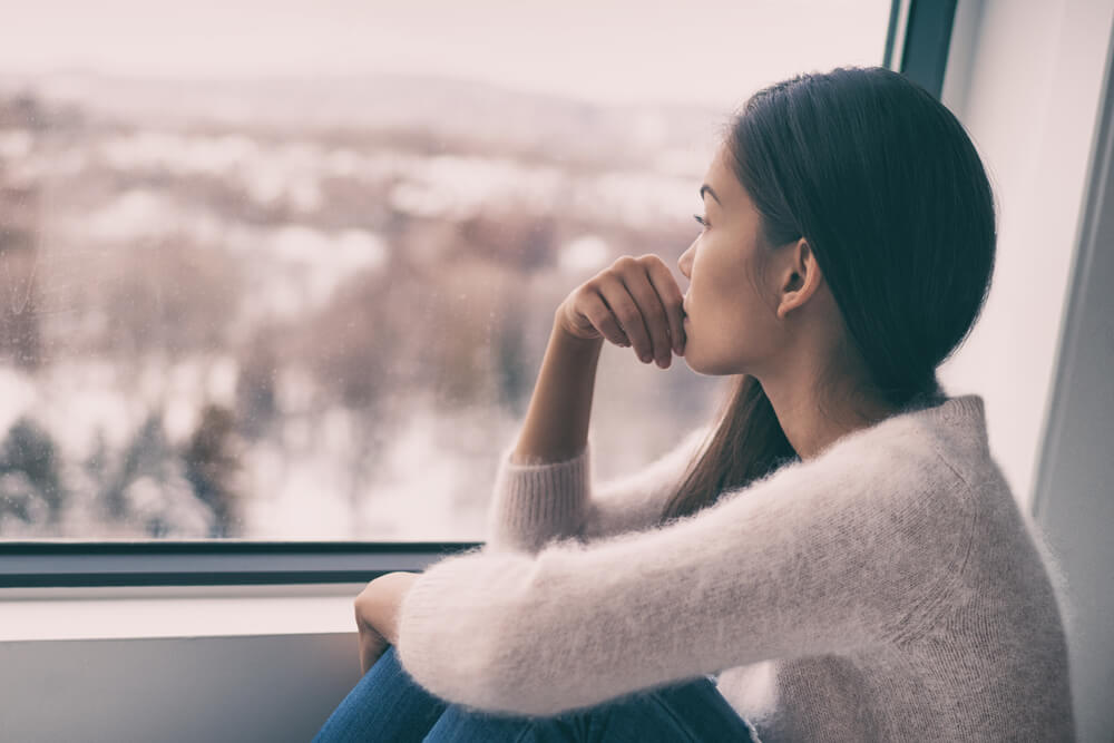 Sad Pensive Woman at Home Winter Depression