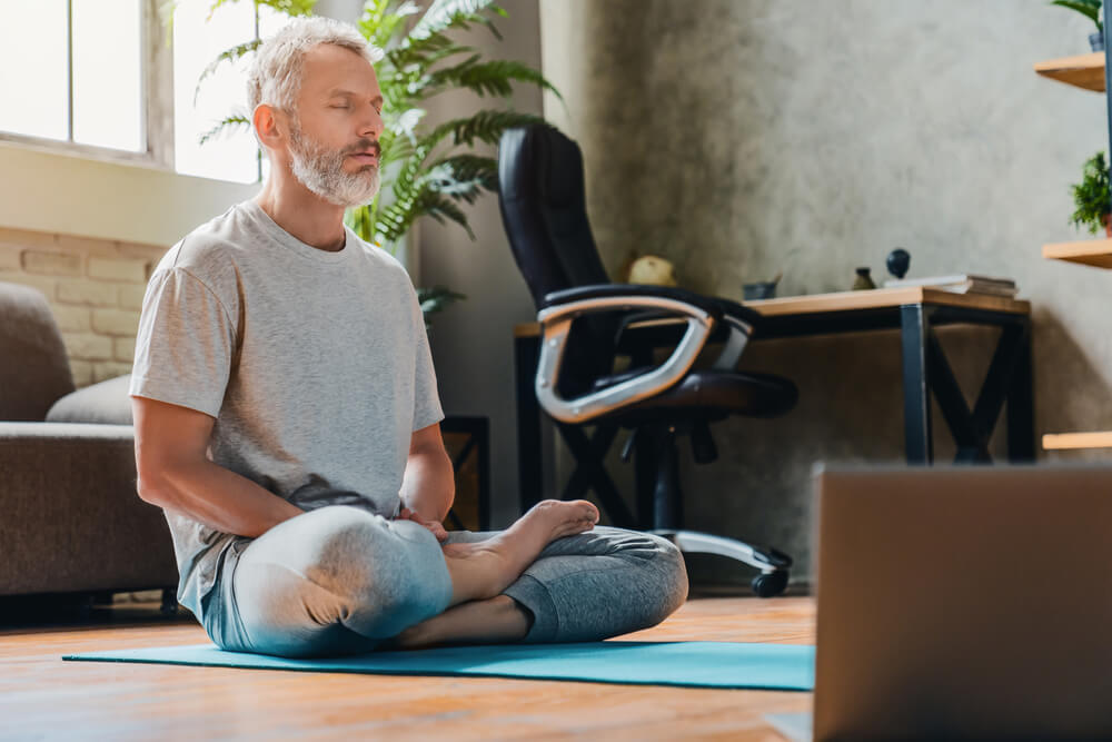 Middle Aged Man Doing Yoga and Fitness at Home