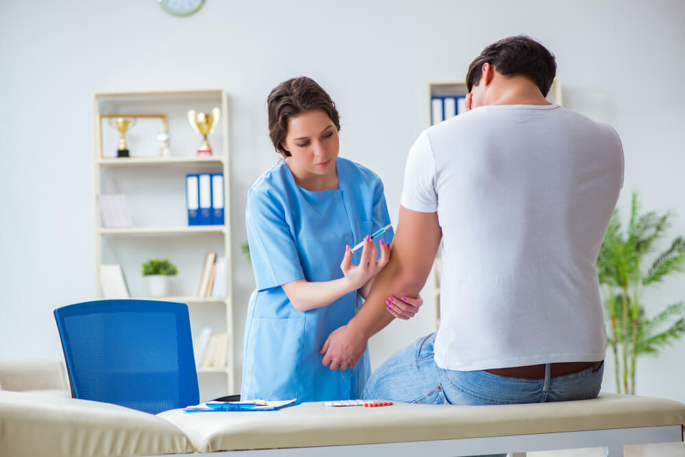 Patient Visitng Doctor for Annual Flu Shot Inoculation for Preve