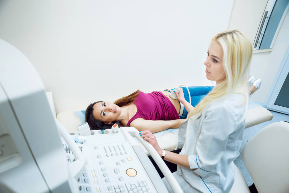 Doctor Performing Ultrasound on a Woman