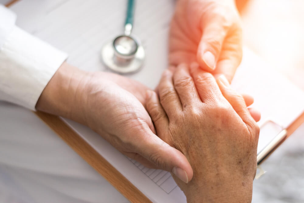 Parkinson and Alzheimer Female Senior Elderly Patient With Physician Doctor in Hospice Care.