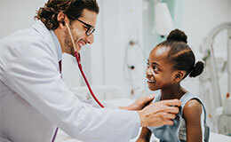 Doctor with little girl