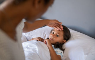 Worried Mother Checking Daughter Temperature