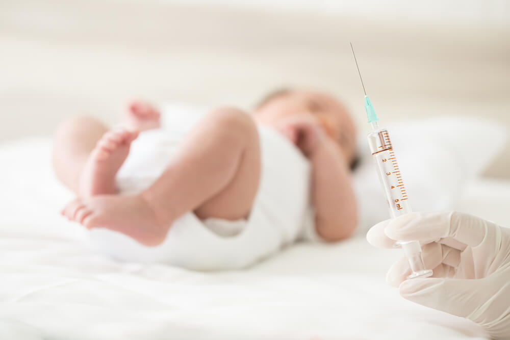 Pediatrician Performs a Vaccination of a Baby