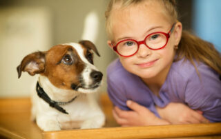 Beautiful Girl With A Down Syndrome With Her Pet Jack Russell Terrier