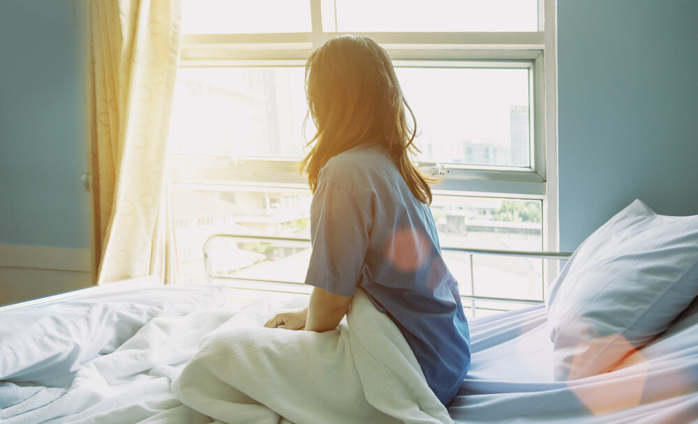 Woman Resting in Hospital Bed