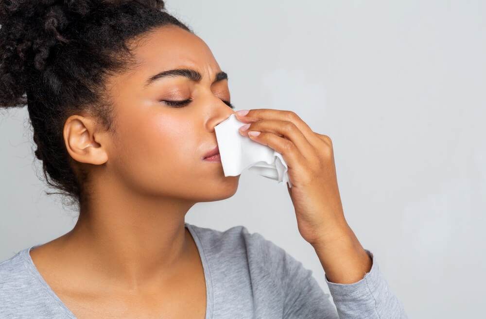 Afro Woman Touching Her Nose With Napkin, Bleeding or Having Runny Nose, Free Space