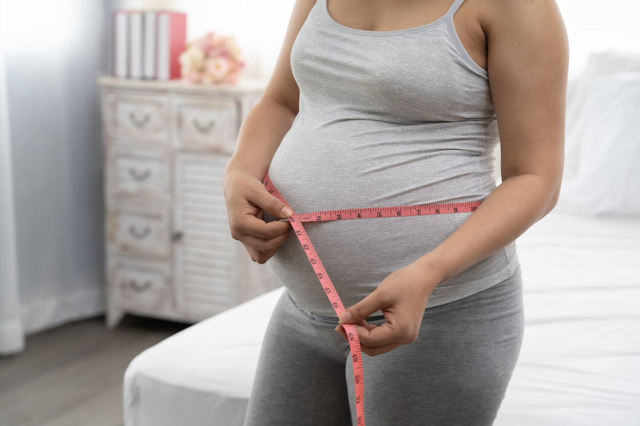 Pregnant Women Are Using a Tape Measure Around the Waist.