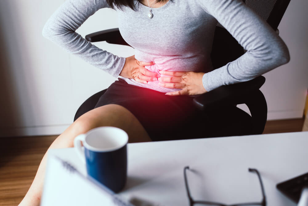 Woman Having Painful Stomach Ache During Working From Home,Female Suffering From Abdominal Pain
