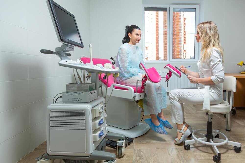 Gynecologist doctor and a patient on a gynecological chair.