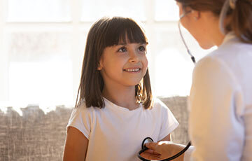 young brown haired girl having a routineyoung brown haired girl having a routine stethoscope exam-1
