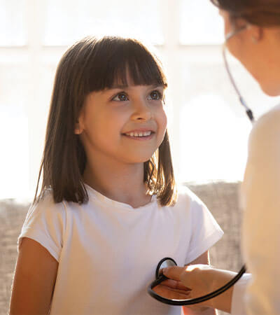 young brown haired girl having a routine stethoscope exam-2