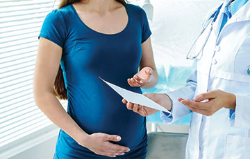 young woman in blue shirt prenatal consultation-1