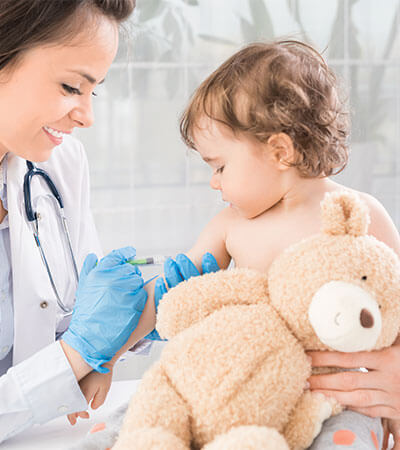 toddler with teddy bear getting vaccinated-2