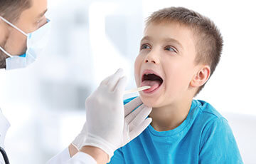 young boy in blue shirt basic throat examination-1