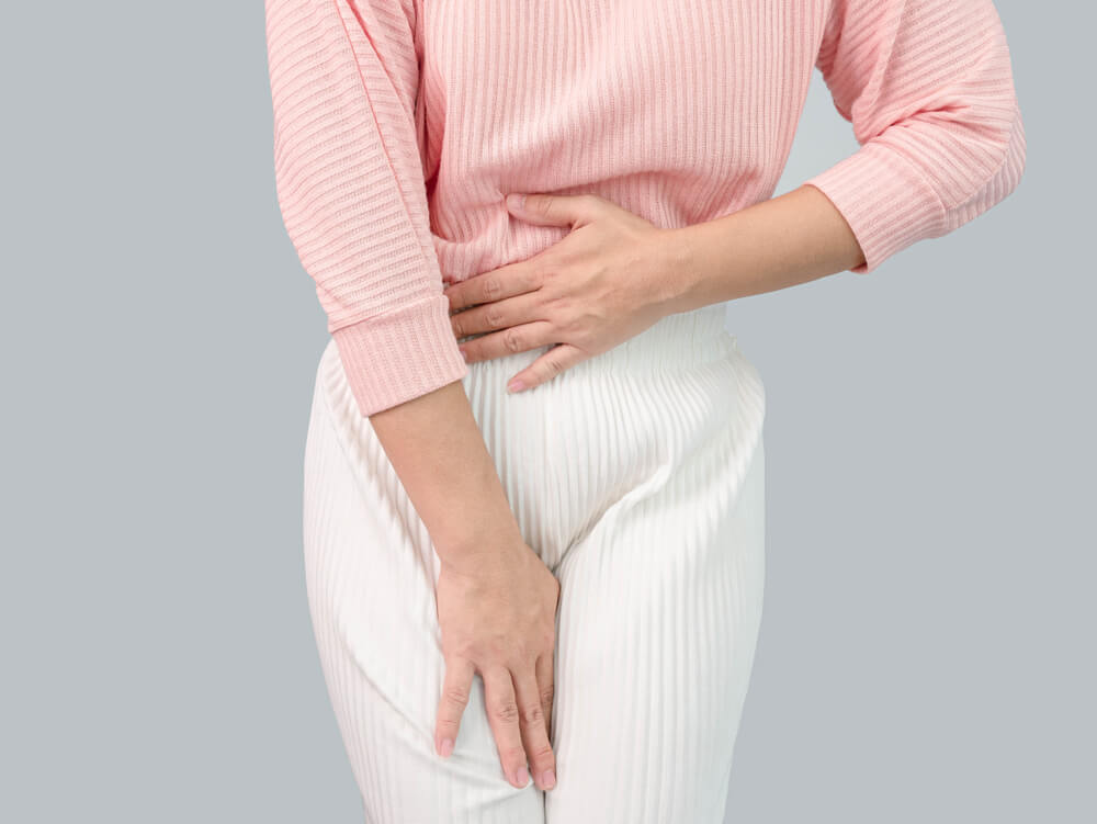 Unhealthy Asian Women Suffer From Abdominal Pain Irregular Menstruation Isolated On A Grey Background