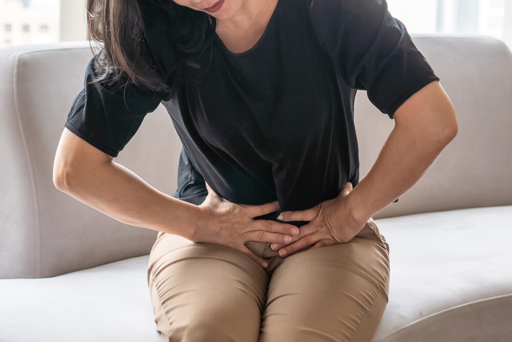 Abdominal Pain in Woman With Stomachache Illness From Menstruation Cramps