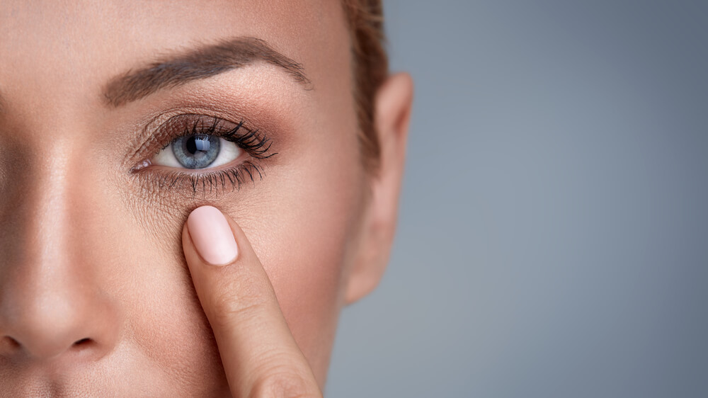 Woman Checking Wrinkles Around the Eyes