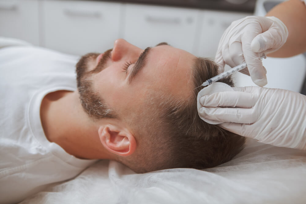 Close Up of a Man Getting Hairloss Injections Treatment by Beautician