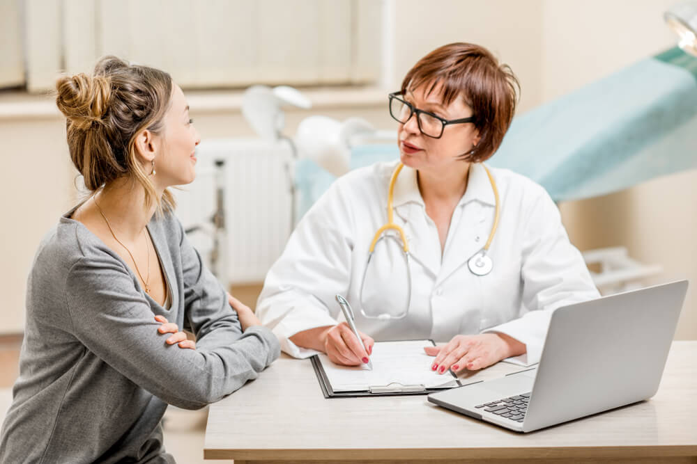 Young Woman Patient With a Senior Gynecologist During a Consultation at The Office