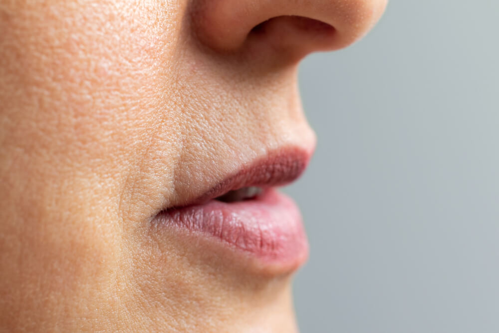 Close Up Macro Detail of Wrinkles Around Mouth and Lips of Middle Aged Woman