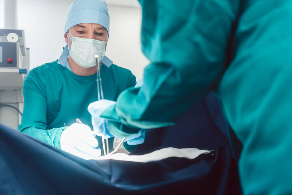 Doctors and Surgeons Operating Patient in Hospital With Full Concentration