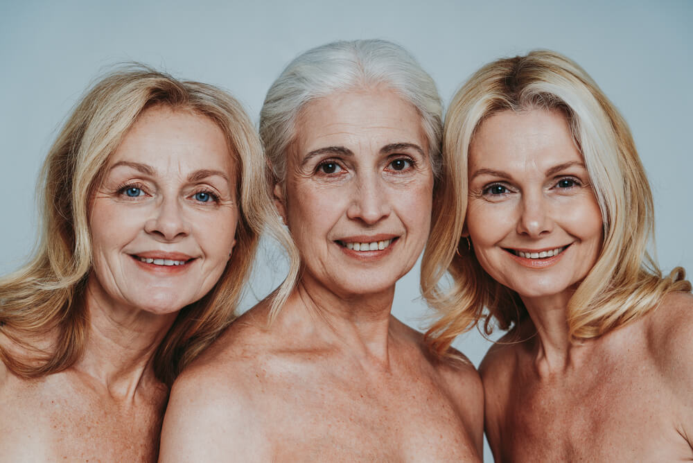 Middle Aged Women in Lingerie on a Grey Background