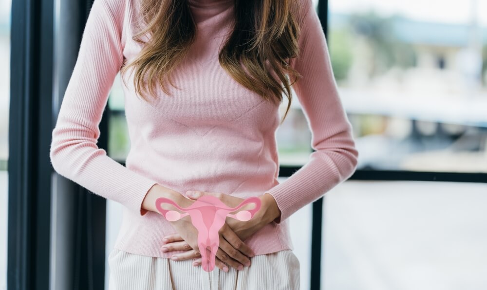 A woman touching virtual uterus, female reproductive system, woman health, PCOS