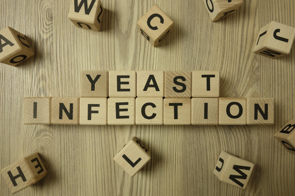 Text Yeast Infection From Wooden Blocks on Desk