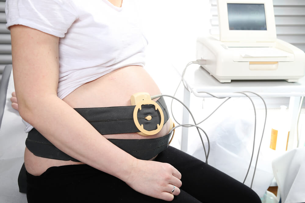 Pregnant Woman Undergoing Cardiotocography. Antenatal Care.