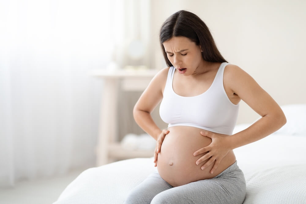 Gynecologist Doctor Conducts A Medical Examination Of A Girl Who Has Pain In The Lower Abdomen.braxton Hicks Contractions.