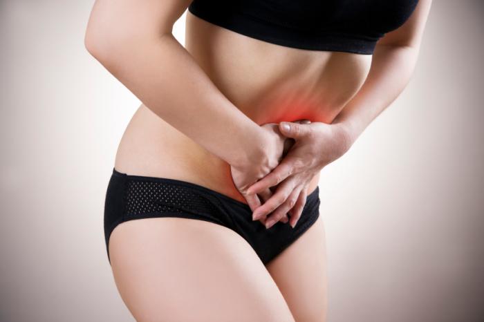 Woman in Black Underwear Having Period Cramps