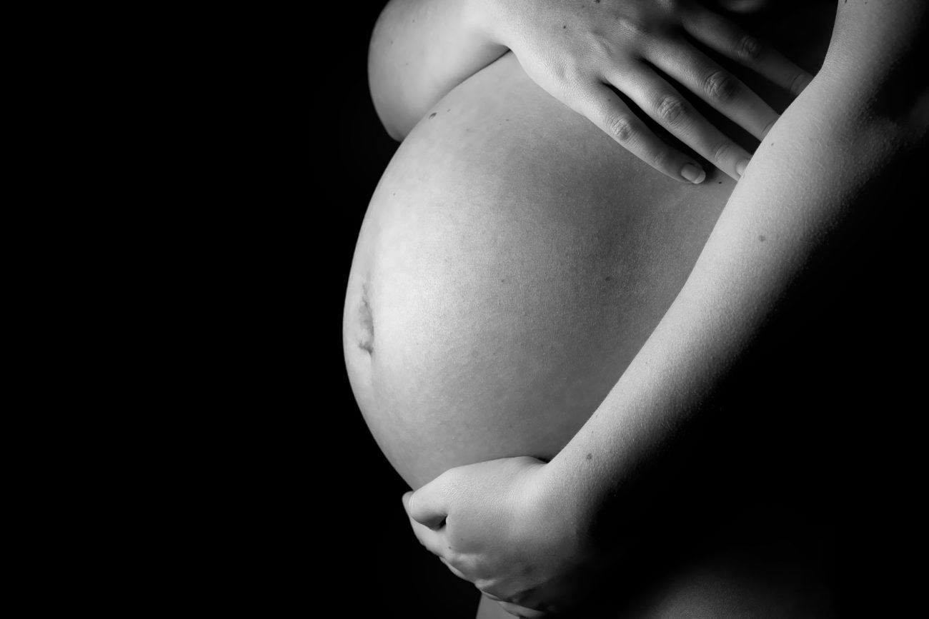 Naked Belly of a Pregnant Woman