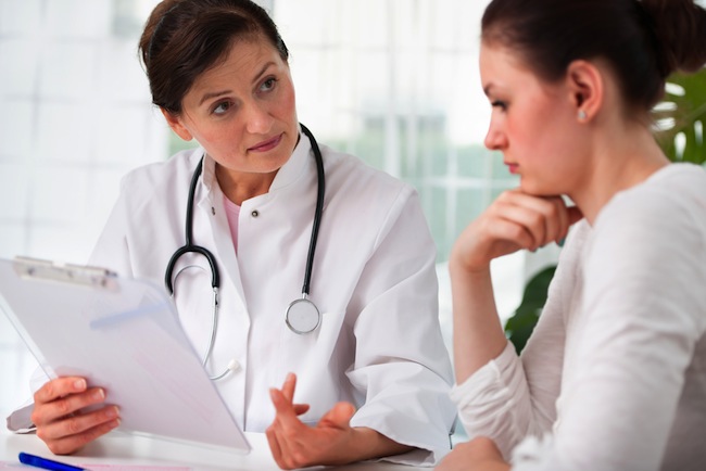 Concerned Female Patient Hearing What the Doctor Has to Say