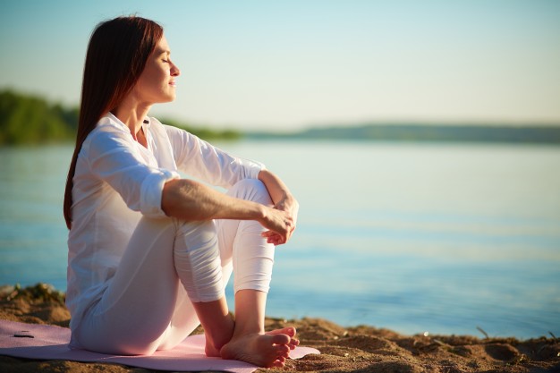 Girl in White Clothes Sitting by the Lake