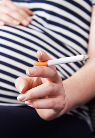 Pregnant Woman Holding a Cigarette