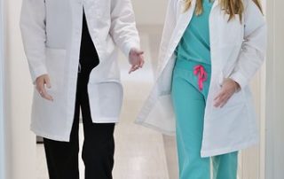 Two Female Doctors Walking Down the Hallway