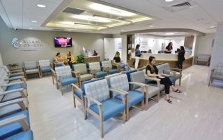 Several People Sitting in Waiting Room at the Clinic