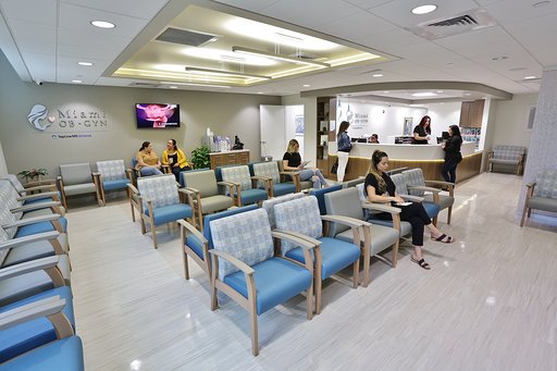 Several People Sitting in Waiting Room at the Clinic