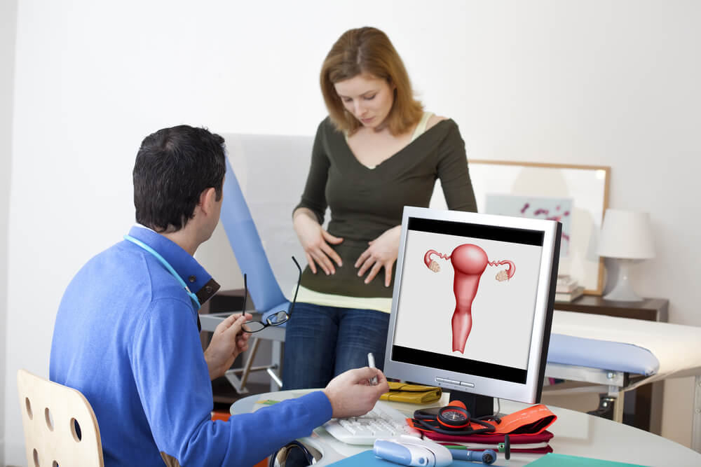 Gynecology Consultation, Woman at the Doctor Touching Stomach