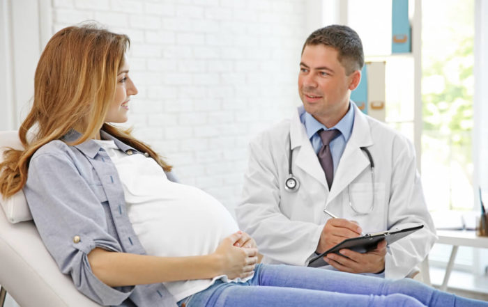 Pregnant Young Woman Visiting Doctor