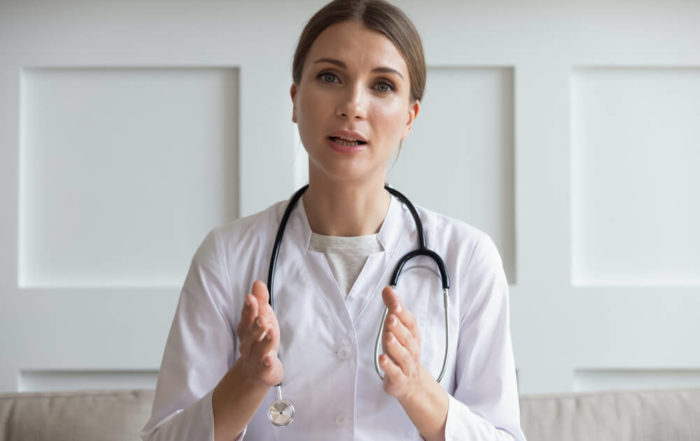 Head Shot Portrait Woman Doctor Talking Online With Patient