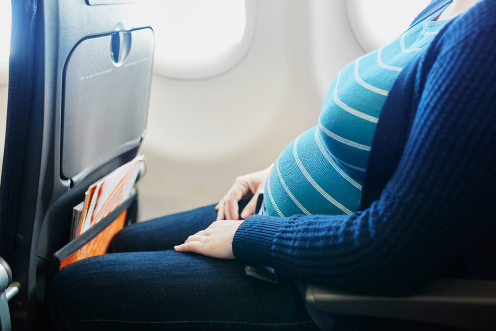 Pregnant Woman at Second Trimester Traveling by Plane