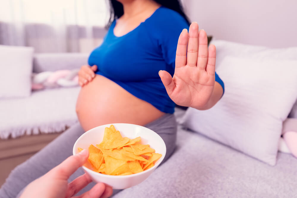 Stop To The Junk Food During Pregnancy Pregnant Woman Refuses To Eat Unhealthy Chips