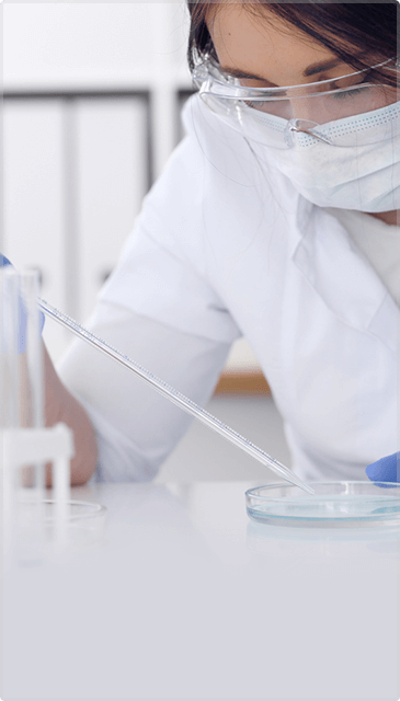 sponsorsIMG Female Doctor Wearing Protective Glasses Doing Lab Research