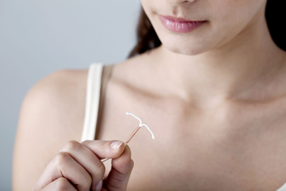 Woman Holding a Iud
